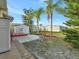Backyard with patio, landscaping, and neighboring homes at 118 Saint Pierres Way, Apollo Beach, FL 33572