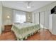 Spacious bedroom with a king-size bed and wood flooring at 118 Saint Pierres Way, Apollo Beach, FL 33572