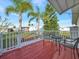 Relaxing deck with metal table and chairs, offering a view of the backyard at 118 Saint Pierres Way, Apollo Beach, FL 33572