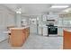 Kitchen with stainless steel appliances and wood cabinets at 118 Saint Pierres Way, Apollo Beach, FL 33572