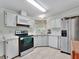 Kitchen with stainless steel appliances and an island at 118 Saint Pierres Way, Apollo Beach, FL 33572
