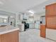 Kitchen with stainless steel appliances and wood cabinets at 118 Saint Pierres Way, Apollo Beach, FL 33572
