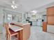 Galley kitchen with stainless steel appliances and an island at 118 Saint Pierres Way, Apollo Beach, FL 33572