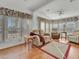 Living room with recliner, sofa, and wood-look flooring at 118 Saint Pierres Way, Apollo Beach, FL 33572