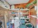 Interior of a cluttered storage shed at 118 Saint Pierres Way, Apollo Beach, FL 33572