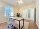 Bright home office with wood floors and ceiling fan at 1320 Misty Greens Dr, Sun City Center, FL 33573