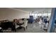 Casual dining area with glass table and white chairs at 17920 Gulf Blvd # 1508, Redington Shores, FL 33708