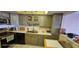 Galley kitchen with ample cabinetry and appliances at 17920 Gulf Blvd # 1508, Redington Shores, FL 33708