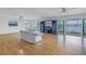 Living Room with hardwood floors, spiral staircase, and water views at 30 Dolphin Dr, Treasure Island, FL 33706