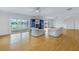 Living Room with hardwood floors, spiral staircase, and water views at 30 Dolphin Dr, Treasure Island, FL 33706