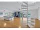 Living Room with hardwood floors, spiral staircase, and water views at 30 Dolphin Dr, Treasure Island, FL 33706