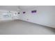 Spacious loft area with carpet and water views at 30 Dolphin Dr, Treasure Island, FL 33706