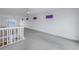 Open loft area with carpet and multiple windows at 30 Dolphin Dr, Treasure Island, FL 33706