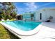 Inviting backyard pool with lounge chairs and a mural, perfect for relaxation and entertaining at 4151 Olive Ave, Sarasota, FL 34231