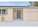 Newly renovated house exterior featuring a modern gray front door and solar panels at 5021 46Th N Ave, St Petersburg, FL 33709