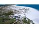 Expansive sandy beach from an aerial view showing the boardwalk and a few beachgoers at 800 Collany Rd # 605 & 606, Tierra Verde, FL 33715