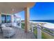 Wide balcony with comfortable seating and breathtaking views of the beach and coastline at 800 Collany Rd # 605 & 606, Tierra Verde, FL 33715