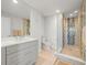 Modern bathroom featuring a spacious glass shower, vanity, and neutral-colored tiles at 800 Collany Rd # 605 & 606, Tierra Verde, FL 33715