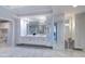 Bright, neutral bathroom with a dual sink vanity and white cabinets for storage at 800 Collany Rd # 605 & 606, Tierra Verde, FL 33715