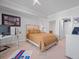 Cozy bedroom with a plush bed, neutral decor, and ample natural light at 800 Collany Rd # 605 & 606, Tierra Verde, FL 33715