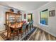 Elegant dining room features an ornate wood table, seating for six, and a window with beach views at 800 Collany Rd # 605 & 606, Tierra Verde, FL 33715