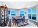 Formal dining room with ocean view and glass enclosed hutch at 800 Collany Rd # 605 & 606, Tierra Verde, FL 33715