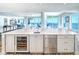 Expansive kitchen with a large island, wine cooler, stainless steel appliances, and stunning ocean views at 800 Collany Rd # 605 & 606, Tierra Verde, FL 33715