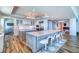 Spacious modern kitchen with seating, updated appliances, an open-concept layout, and elegant recessed lighting at 800 Collany Rd # 605 & 606, Tierra Verde, FL 33715