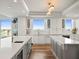 Modern kitchen featuring dual islands, sleek cabinetry, stainless steel appliances, and beautiful waterfront vistas at 800 Collany Rd # 605 & 606, Tierra Verde, FL 33715