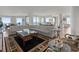 Spacious living room featuring comfortable seating, elegant decor, and scenic water views from expansive windows at 800 Collany Rd # 605 & 606, Tierra Verde, FL 33715