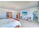 Bright main bedroom features a large bed, television, ensuite, and ample seating areas at 800 Collany Rd # 605 & 606, Tierra Verde, FL 33715