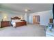 Spacious main bedroom features wood furniture, soft lighting, and a glimpse into the walk-in closet at 800 Collany Rd # 605 & 606, Tierra Verde, FL 33715