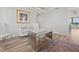 Bright office with modern desk, chair, white filing cabinet, light wood floors, and neutral tones at 800 Collany Rd # 605 & 606, Tierra Verde, FL 33715