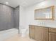 Modern bathroom with gray tile and updated fixtures at 800 Collany Rd # 605 & 606, Tierra Verde, FL 33715
