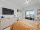 Bright bedroom with large TV and walk-in closet at 800 Collany Rd # 605 & 606, Tierra Verde, FL 33715