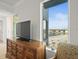 Bedroom with water views and built-in dresser at 800 Collany Rd # 605 & 606, Tierra Verde, FL 33715