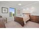 Comfortable bedroom with a sleigh bed and hardwood floors at 800 Collany Rd # 605 & 606, Tierra Verde, FL 33715