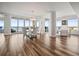 Elegant dining room with glass table, white chairs, and breathtaking ocean views at 800 Collany Rd # 605 & 606, Tierra Verde, FL 33715