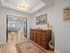 Elegant entryway with hardwood floors and statement furniture at 800 Collany Rd # 605 & 606, Tierra Verde, FL 33715