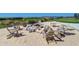 Community fire pit with Adirondack chairs for relaxing evenings at 800 Collany Rd # 605 & 606, Tierra Verde, FL 33715