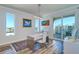 Bright home office features a modern desk, hardwood floors, and stunning water views at 800 Collany Rd # 605 & 606, Tierra Verde, FL 33715