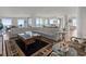 Elegant living room with a large sectional sofa and hardwood floors at 800 Collany Rd # 605 & 606, Tierra Verde, FL 33715