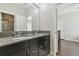 Bathroom with double vanity and dark brown cabinets at 8002 Marbella Creek Ave, Tampa, FL 33625