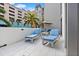 Private balcony with lounge chairs and city views at 100 1St N Ave # 201, St Petersburg, FL 33701