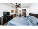 Spacious bedroom with a large bed, dresser, and ceiling fan at 1609 Lakeview Rd, Clearwater, FL 33756