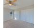 Bedroom with carpet, ceiling fan and double doors at 205 Grayson Ct, Sun City Center, FL 33573