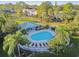 Aerial view of community pool with lounge chairs at 2345 Lake Woodberry Cir, Brandon, FL 33510