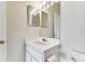Clean bathroom with single sink vanity and mirrored medicine cabinet at 2345 Lake Woodberry Cir, Brandon, FL 33510