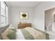 Bedroom with a bed, dresser, and view of a window at 2345 Lake Woodberry Cir, Brandon, FL 33510