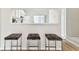 Kitchen with breakfast bar and three dark gray stools at 2345 Lake Woodberry Cir, Brandon, FL 33510